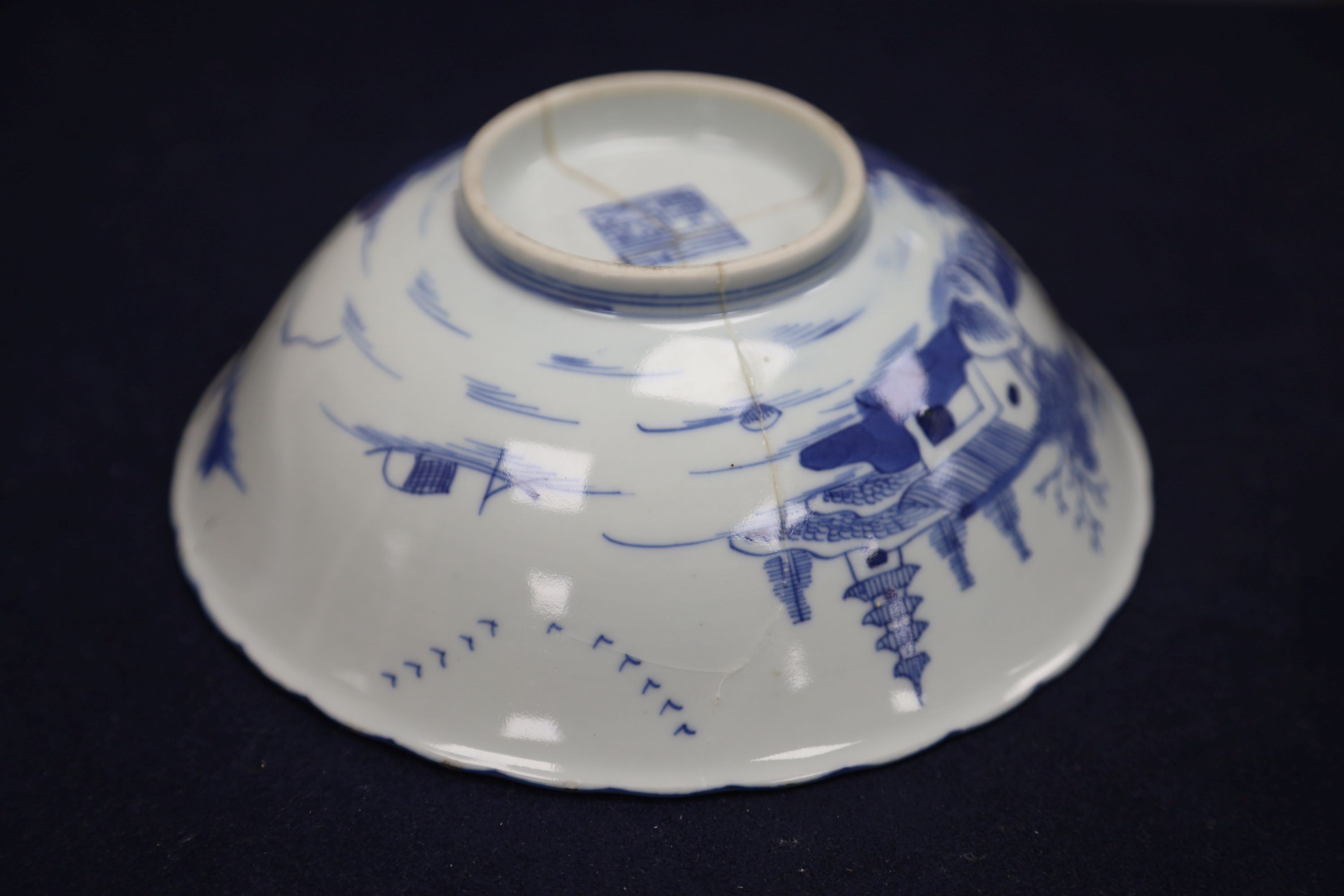 A Chinese blue and white landscape bowl, a/f and a Chinese blue and white 'dragon' dish, 18cm and 16.5cm